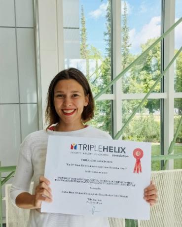 Andrea Braun Střelcová poses with her award certificate