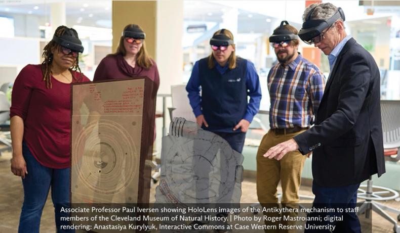 People viewing HoloLens images of the Antikythera mechanism