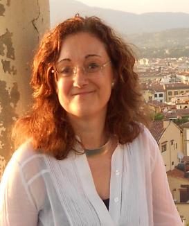 Maria Montserrat Cabré Pairet sitting above a city in the sunlight