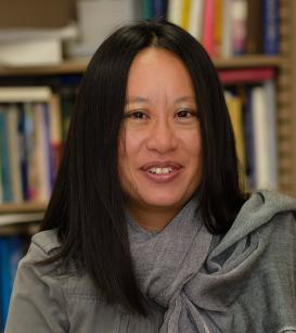 Florence Hsia in front of a bookshelf