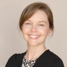 profile picture of Michelle McCoy smiling into the camera, light grey background