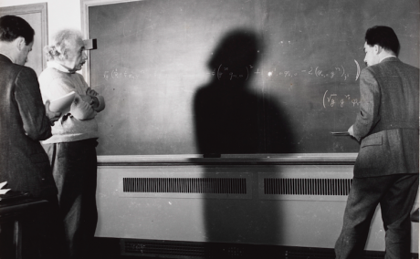 Albert Einstein at Princeton, standing in front of a blackboard