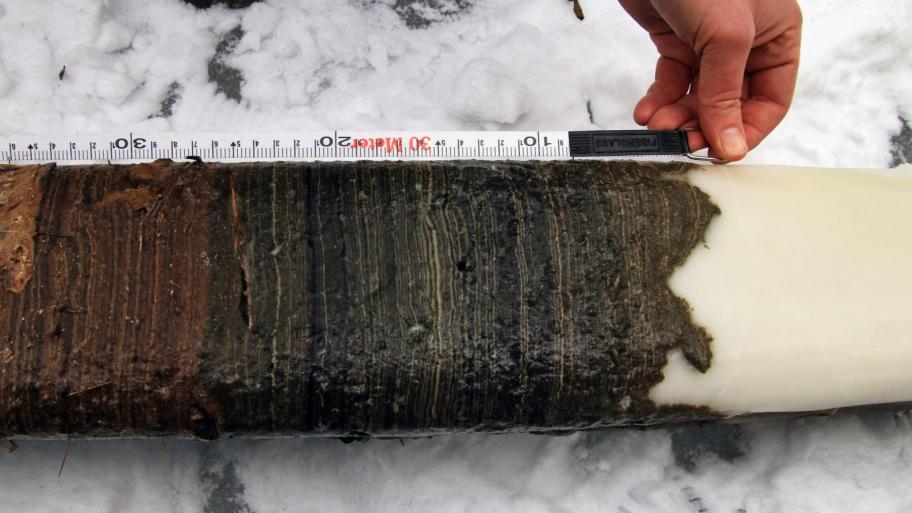 Photo,   On-site measuring of a sediment core at the GSSP candidate site Crawford Lake, Canada. 
