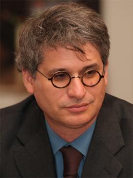 profile picture of David A. Bello (wearing a suit and glasses)